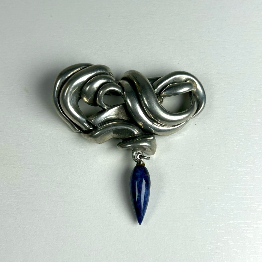 Vintage elegant silver tone twisted ribbon with Blue dangling bead brooch